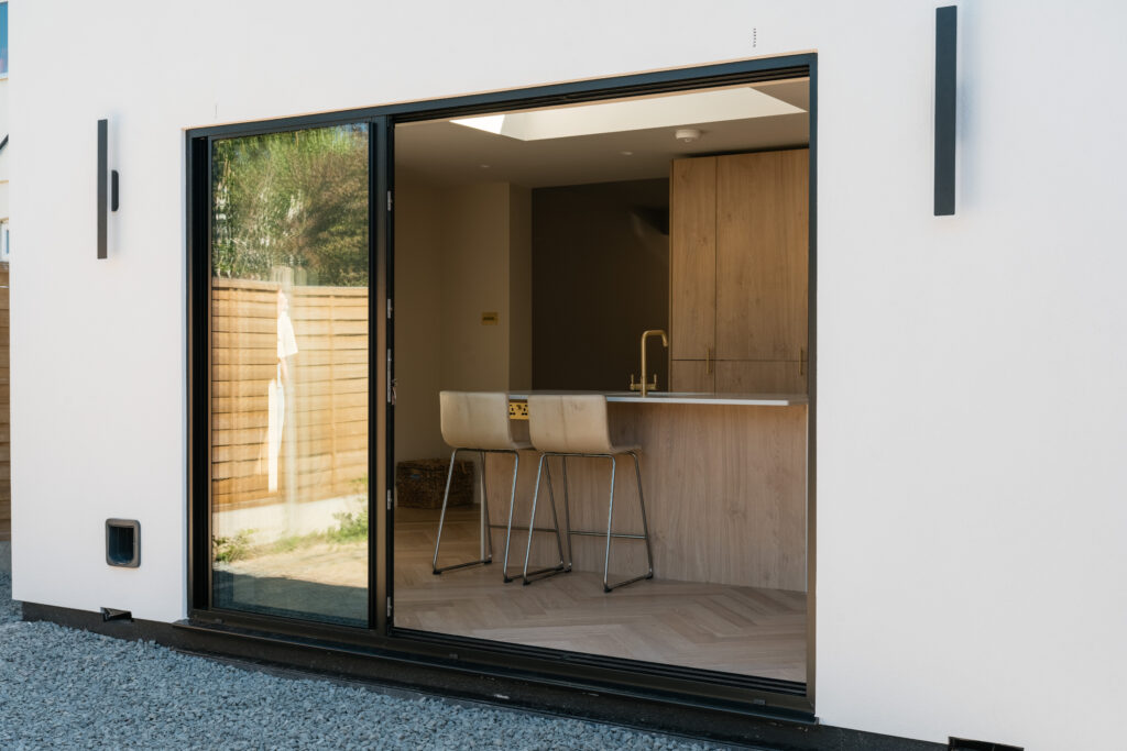 Sliding doors connecting kitchen to garden Expert Installation promoting natural light in Hornchurch
